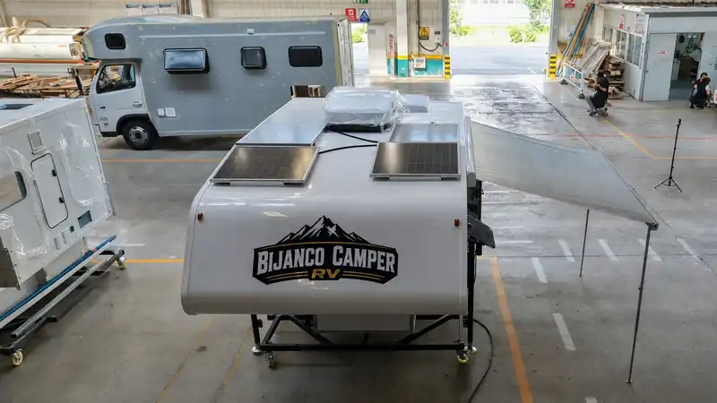 Bijanco pickup camper with its roof awning extended for shade